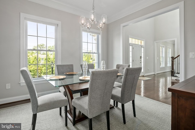 7911 Fort Hunt Rd, Alexandria, VA 22308 - dining room with wood finished floors, a chandelier, stairway, baseboards, and crown molding