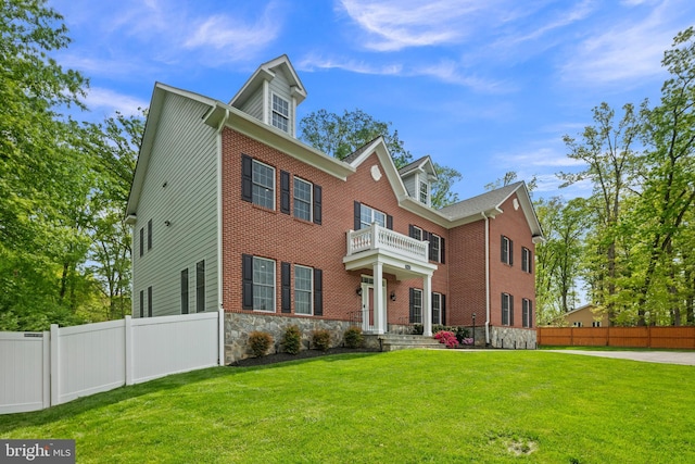 7911 Fort Hunt Rd, Alexandria, VA 22308 - georgian-style home with a balcony and stone siding