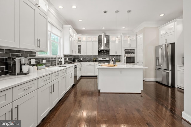 7911 Fort Hunt Rd, Alexandria, VA 22308 - kitchen with stainless steel appliances, wall chimney exhaust hood, white cabinets, crown molding, and recessed lighting