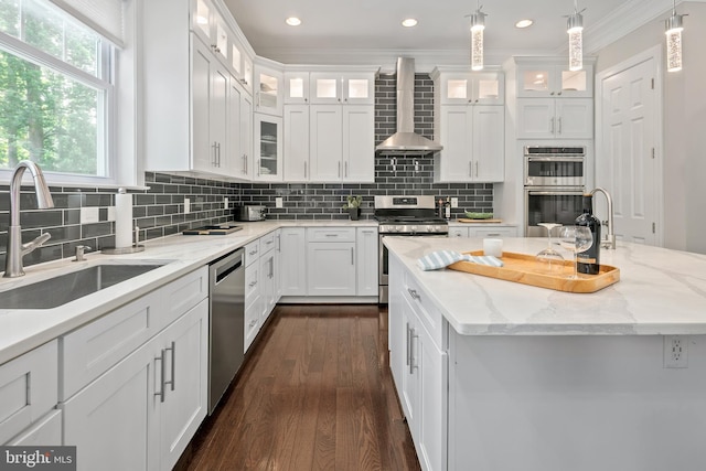 7911 Fort Hunt Rd, Alexandria, VA 22308 - kitchen with a sink, appliances with stainless steel finishes, wall chimney range hood, white cabinetry, and dark wood-type flooring