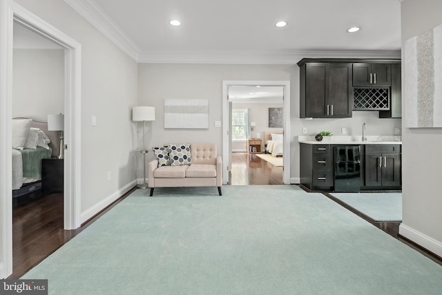 7911 Fort Hunt Rd, Alexandria, VA 22308 - living area featuring bar with sink, wood finished floors, ornamental molding, baseboards, and recessed lighting