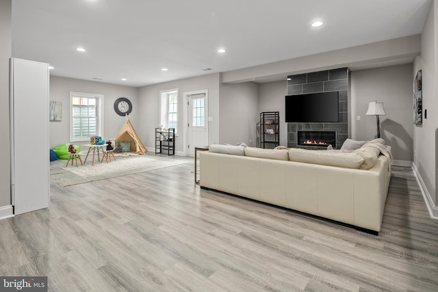 7911 Fort Hunt Rd, Alexandria, VA 22308 - living area with baseboards, a tile fireplace, wood finished floors, and recessed lighting