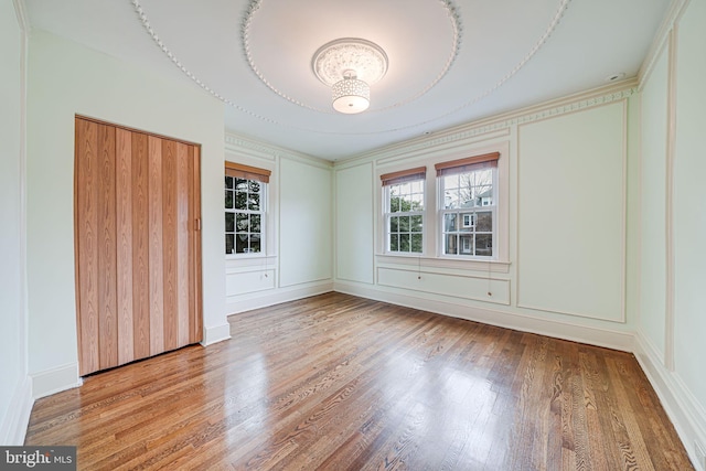 1400 Montague St NW, Washington, DC 20011 - unfurnished room featuring wood finished floors and a decorative wall