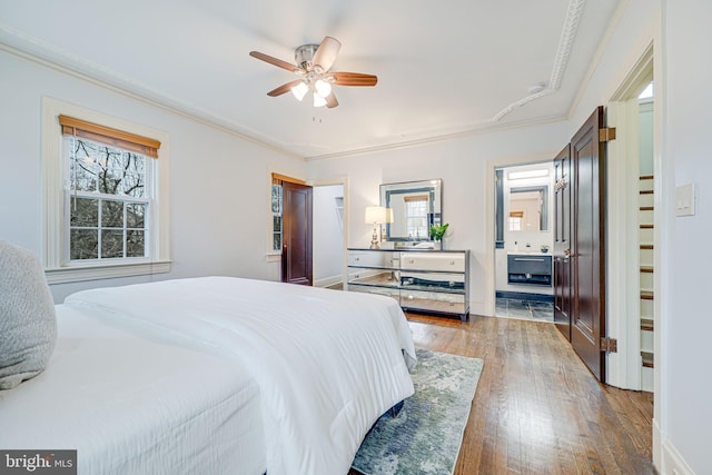 1400 Montague St NW, Washington, DC 20011 - bedroom featuring crown molding, a ceiling fan, and hardwood / wood-style floors