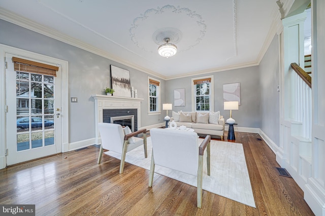 1400 Montague St NW, Washington, DC 20011 - living room with baseboards, wood finished floors, a fireplace, and crown molding