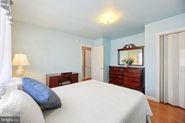 bedroom with wood finished floors