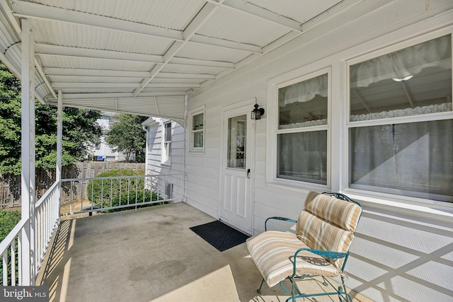 view of patio / terrace with fence and covered porch