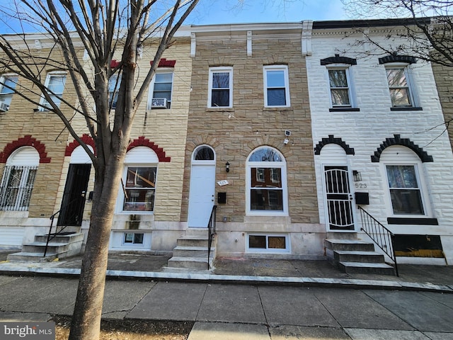 multi unit property with entry steps and stone siding