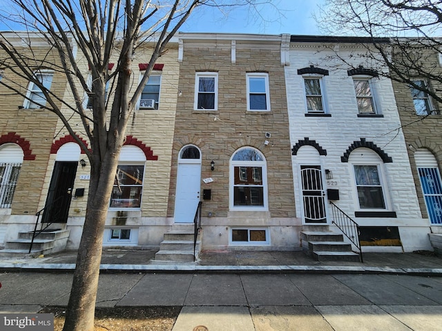 multi unit property with entry steps and stone siding