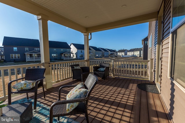 wooden deck featuring a residential view