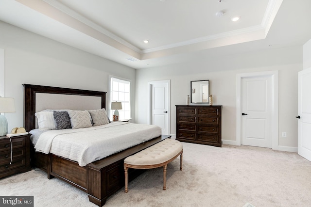 bedroom with baseboards, light colored carpet, a tray ceiling, crown molding, and recessed lighting