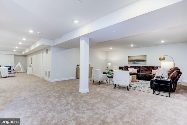 carpeted living room featuring baseboards, visible vents, and recessed lighting