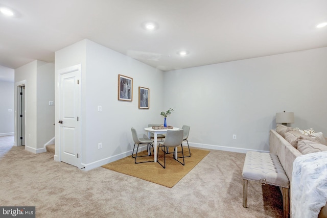 carpeted dining space featuring recessed lighting and baseboards