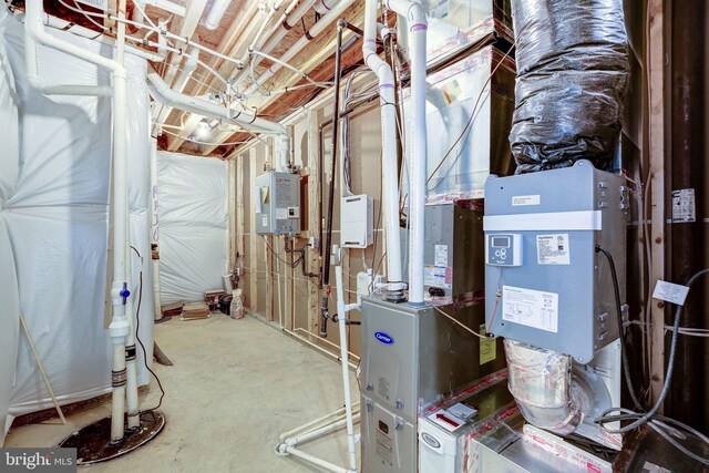 utility room with water heater