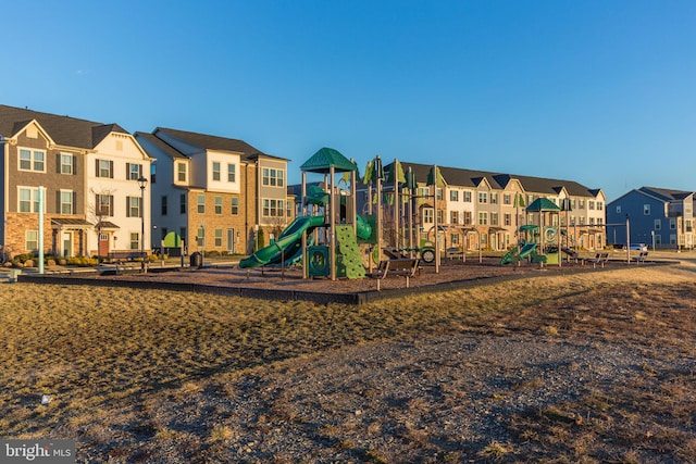 communal playground featuring a residential view