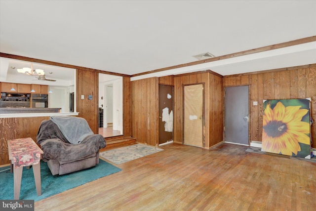 444 Rocksville Rd, Holland, PA 18966 - living area featuring a chandelier, wood finished floors, and wooden walls