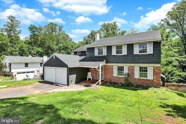 444 Rocksville Rd, Holland, PA 18966 - colonial house with a front yard, brick siding, a chimney, and a detached garage