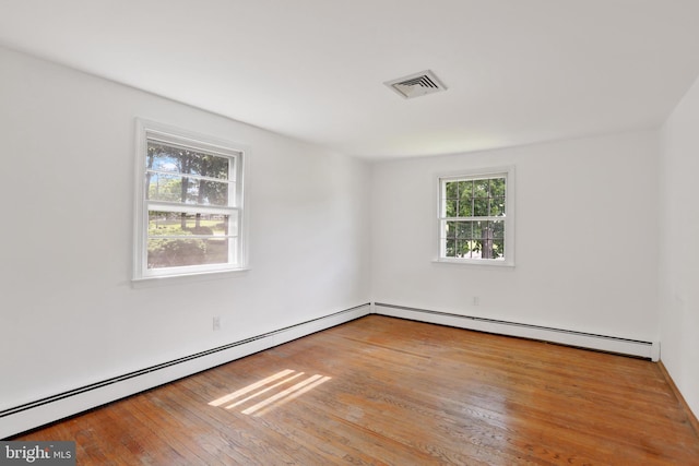 444 Rocksville Rd, Holland, PA 18966 - empty room with wood-type flooring and a baseboard radiator