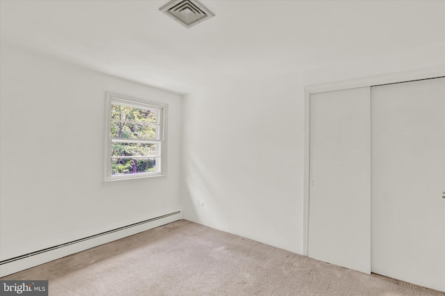 444 Rocksville Rd, Holland, PA 18966 - unfurnished bedroom with a baseboard radiator, carpet, and a closet