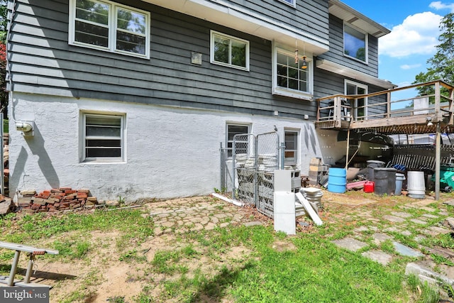 444 Rocksville Rd, Holland, PA 18966 - rear view of property with a wooden deck and stucco siding