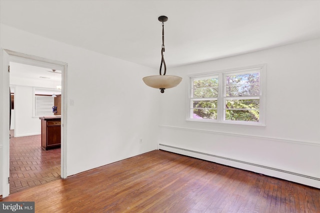 444 Rocksville Rd, Holland, PA 18966 - unfurnished room featuring a baseboard heating unit and wood finished floors