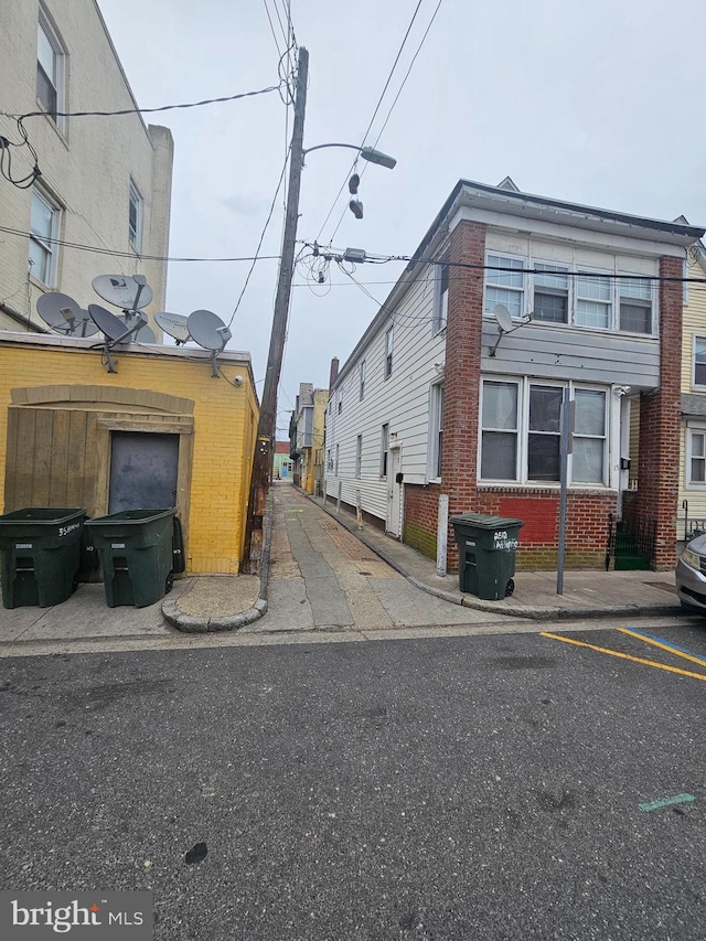 view of road featuring street lighting and sidewalks