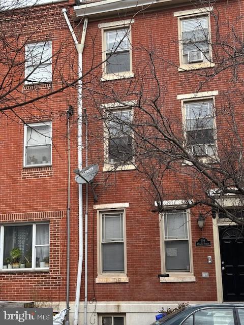 view of home's exterior with brick siding