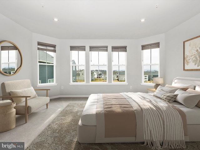 carpeted bedroom featuring recessed lighting and baseboards