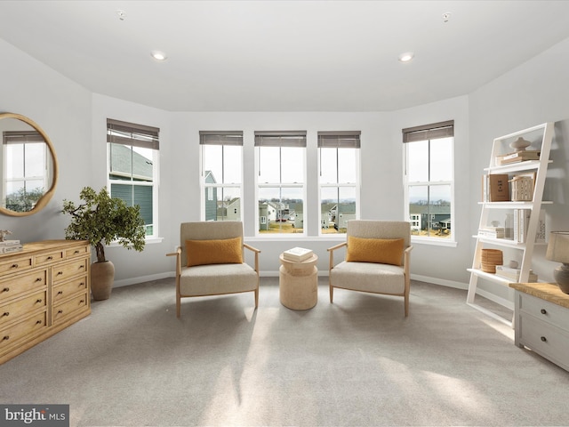 living area featuring plenty of natural light, recessed lighting, and baseboards