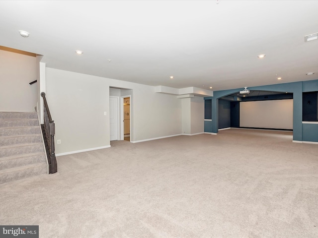 unfurnished living room featuring carpet flooring, recessed lighting, stairway, and baseboards