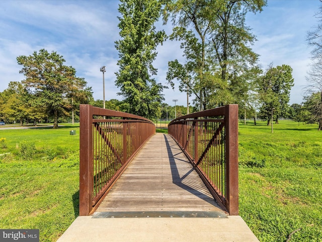 view of gate featuring a yard