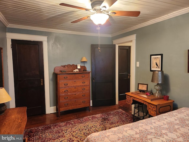 bedroom featuring a ceiling fan, ornamental molding, and wood finished floors