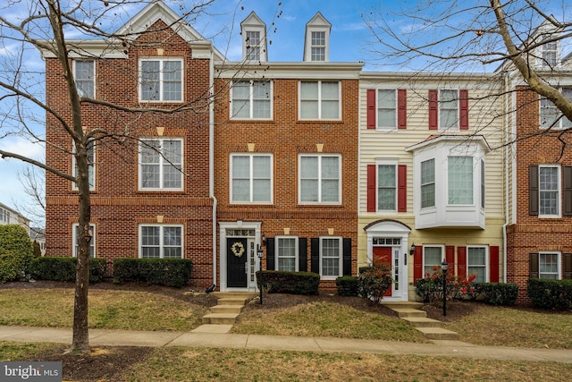 multi unit property featuring brick siding