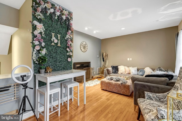 living room with recessed lighting and light wood-type flooring