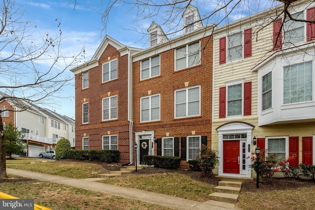 view of property featuring brick siding