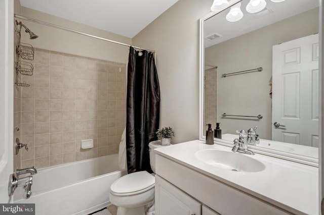 bathroom featuring shower / bathtub combination with curtain, toilet, visible vents, and vanity