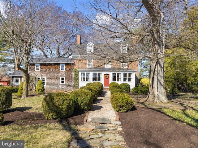 view of front of property featuring a chimney