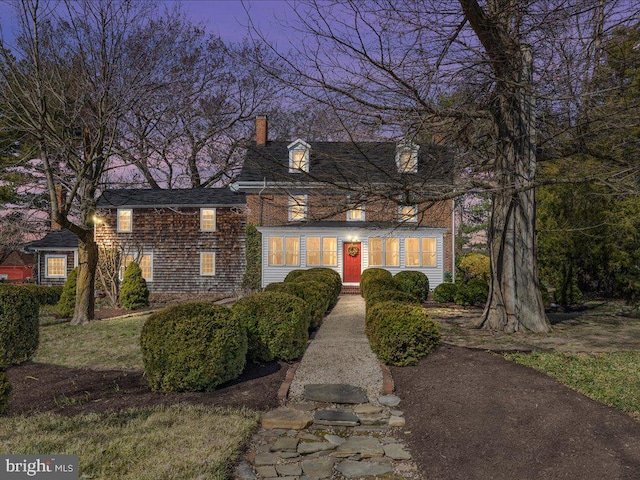 view of front of home featuring a chimney