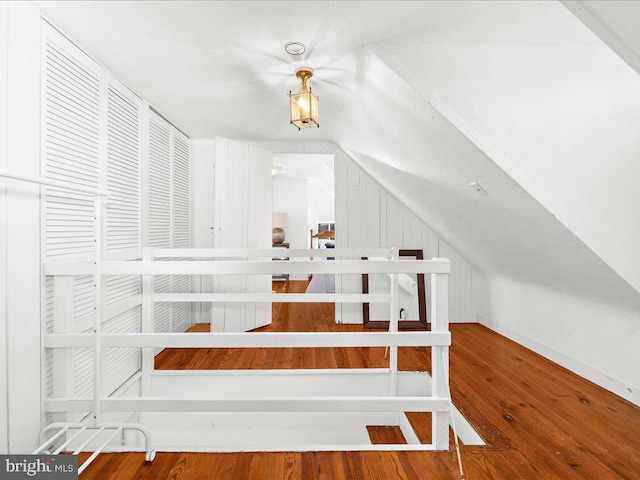 interior space with vaulted ceiling and wood finished floors