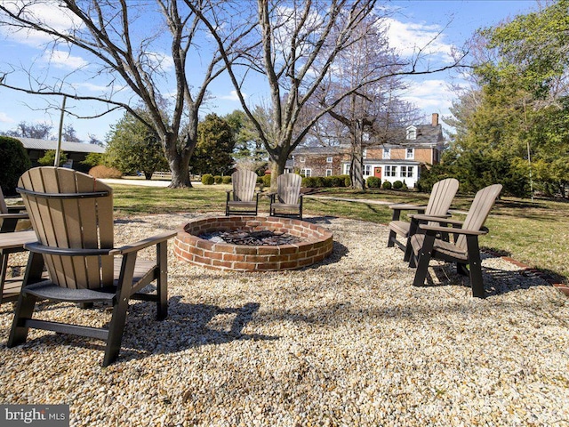 view of yard with an outdoor fire pit and a patio