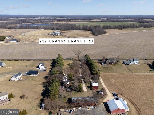 birds eye view of property featuring a rural view