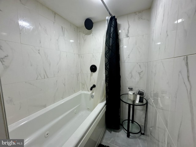 bathroom with shower / bath combination with curtain and tile walls