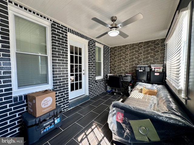 wooden terrace featuring ceiling fan