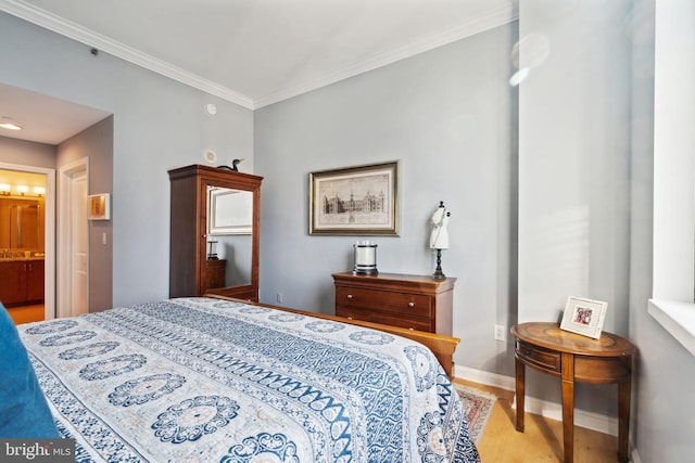 bedroom with baseboards, light wood-style flooring, and crown molding