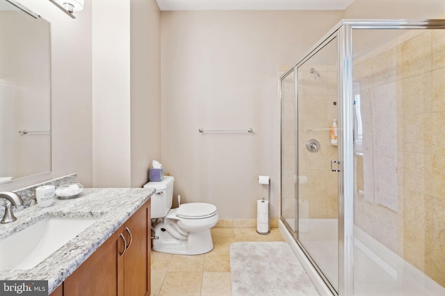 bathroom with tile patterned flooring, a shower stall, toilet, and vanity