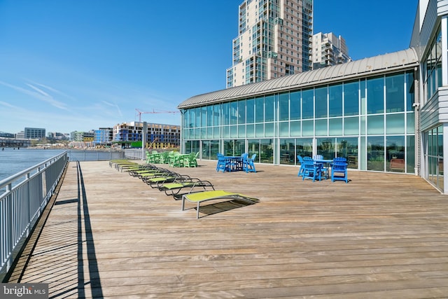 wooden deck featuring a view of city