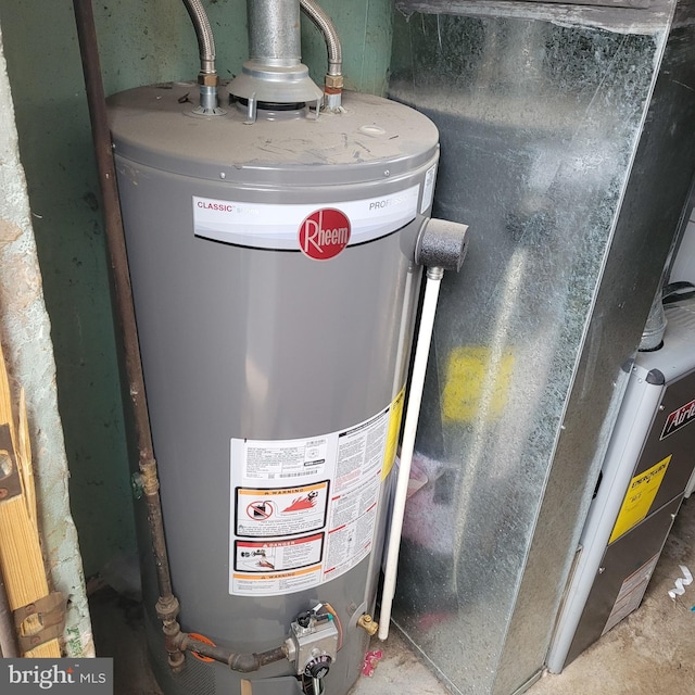 utility room featuring gas water heater