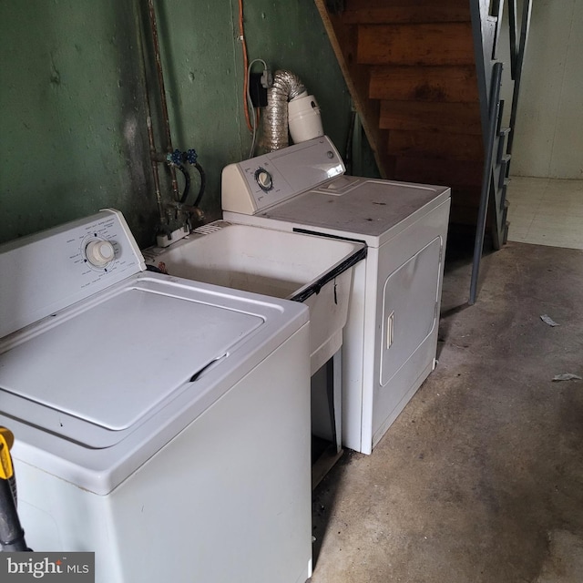 clothes washing area with laundry area and separate washer and dryer