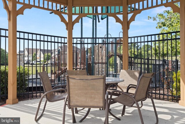 view of patio featuring outdoor dining area