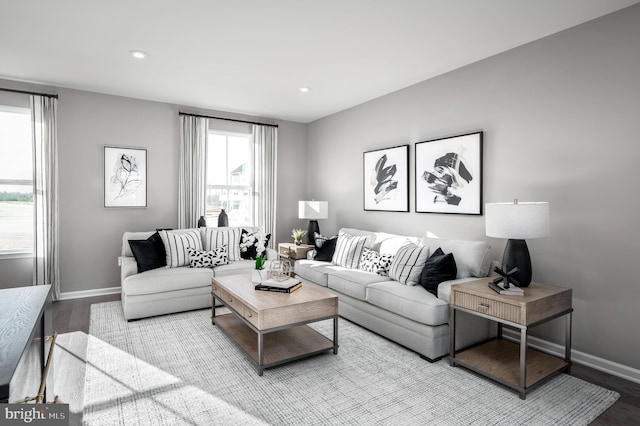 living room with baseboards, wood finished floors, and recessed lighting